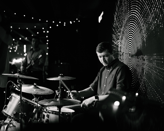 black and white image of drummer at melomania venue